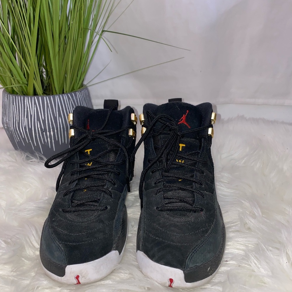 Jordan 12 reverse taxi black and white.
